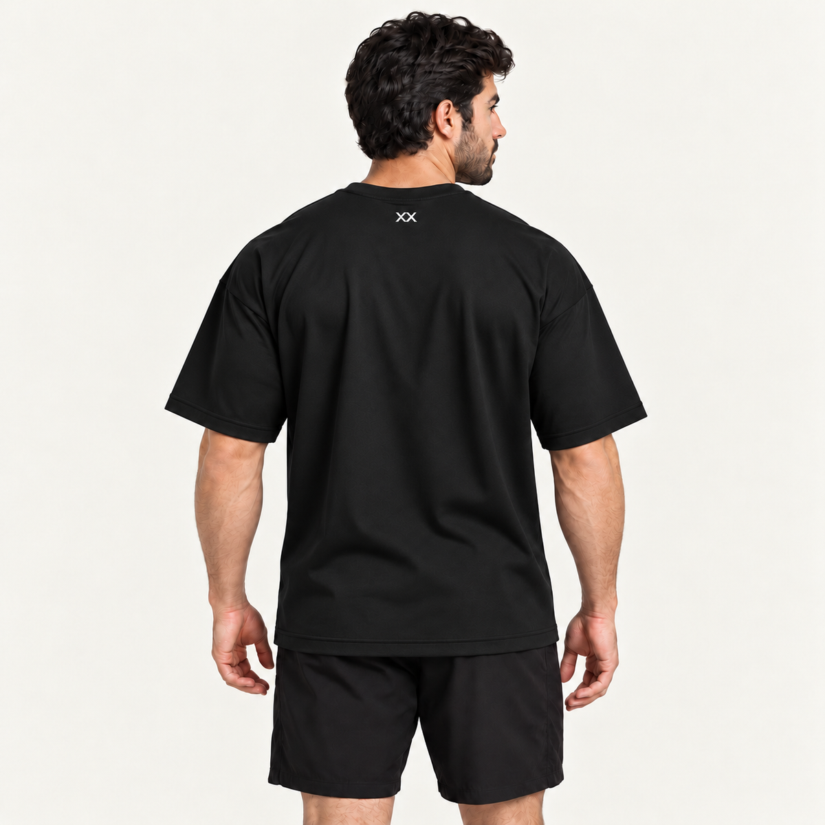 Camiseta Oversized Premium Grexx preta — costas com símbolo XX na nuca