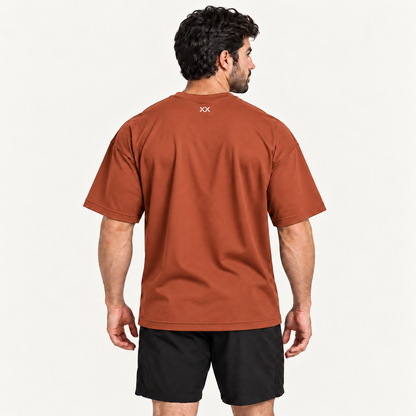 Camiseta Oversized Premium Grexx terracota — costas com símbolo XX na nuca